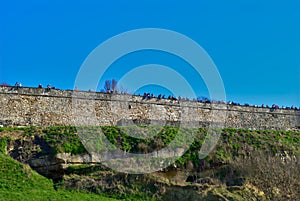 Medieval walls with people on them