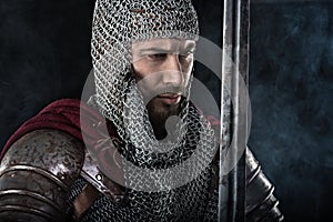 Medieval Warrior with chain mail armour and red Cloak