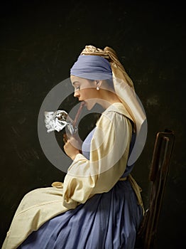 Medieval Woman in Historical Costume Wearing Corset Dress and Bonnet.