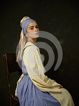 Medieval Woman in Historical Costume Wearing Corset Dress and Bonnet.