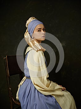 Medieval Woman in Historical Costume Wearing Corset Dress and Bonnet.