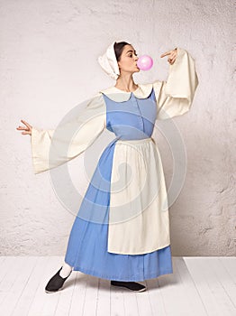 Medieval Woman in Historical Costume Wearing Corset Dress and Bonnet.