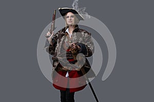 Medieval woman pirate with saber and handgun