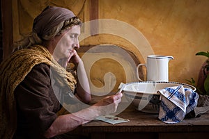 Medieval woman reading letter