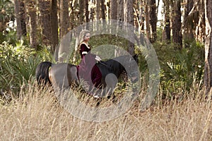 Medieval woman riding horse