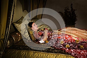 Medieval woman sleeping like cinderella