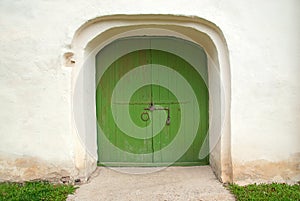Medieval wooden door painted in green