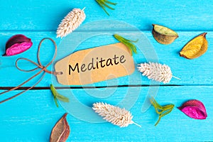 Meditate text on paper tag photo