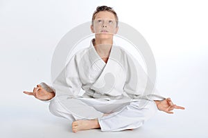 Meditating karate boy