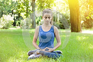 Meditating teenage girl