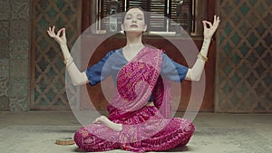 Meditating woman practicing yoga lotus pose