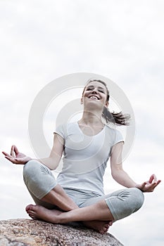 Meditating yoga woman in meditation in nature.