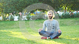 Meditation in everyday life conditions. Concept. Portrait of a young male in casual clothes practicing meditation and