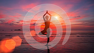 Meditation girl on the sea during sunset. Yoga silhouette.