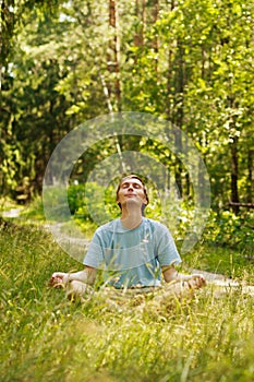 Meditation in green forest photo
