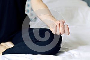 Meditation at home hand of a Zen woman doing yoga