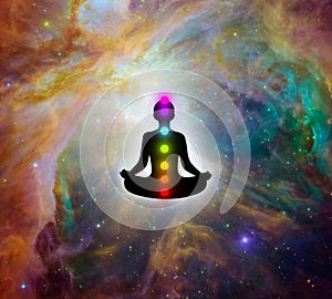 Meditation man with seven chakras and the wonderful of the universe