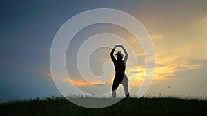 Meditation near the sea doing yoga on a beach at sunrise