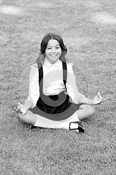 Meditation practice. Good vibes. Peaceful meditation. Learn meditation techniques. Girl school pupil sit on lawn. Tune