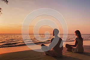 meditation and relaxation for couple, yoga group on the beach