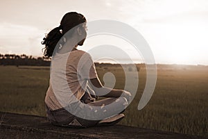 Meditation And Relaxation On A Ricefield Sunset