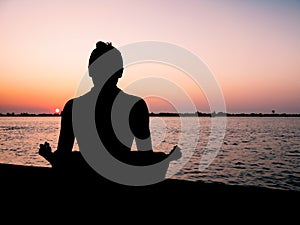 Meditation at sunset photo