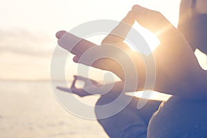 Meditation woman doing yoga exercises seafront