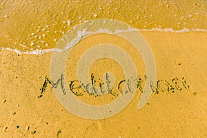 Meditation written on sand