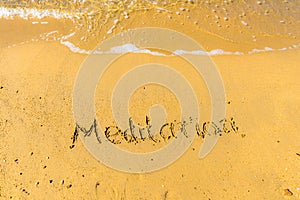 Meditation written on sand