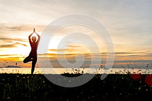 Meditation yoga lifestyle woman silhouette on the Sea sunset, relax vital