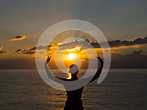 Meditation, yoga practice on the beach at sunset. Meditation, healthy life and harmony concept