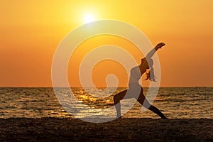 Meditation yoga spirit lifestyle mind woman peace vitality, silhouette outdoors on the Sea sunrise, photo