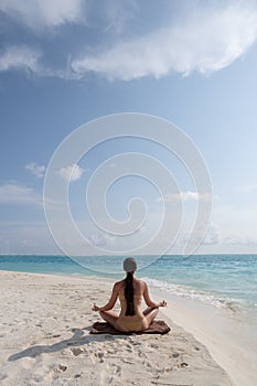Meditation - Yoga woman meditating at serene beach