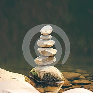 Meditative balance Zen stones placed harmoniously by the river