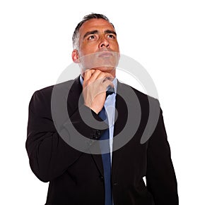 Meditative businessman touching the chin