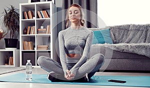 Meditative lady sitting on floor