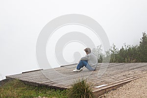 Meditative man seating photo