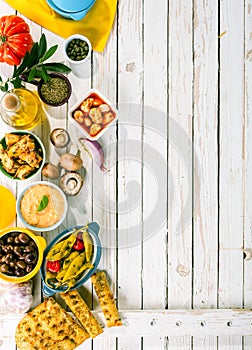 Mediterranean Appetizers on White Picnic Table