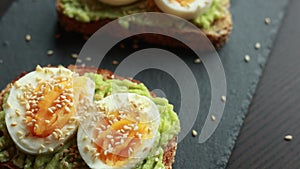 Mediterranean avocado toast with boiled egg and sesame