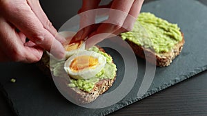 Mediterranean avocado toast with boiled egg and sesame
