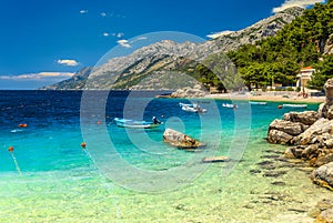 Mediterranean bay and beach with motorboats, Brela, Dalmatia region, Croatia