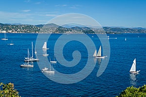 Mediterranean bay with sailing yachts at anchor. Saint-Tropez gulf.