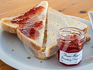 Mediterranean breakfast with slices of toasted bread and jam