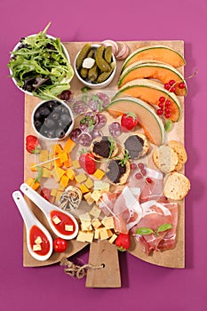Mediterranean buffet food assorted on wooden board