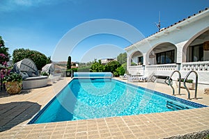 Mediterranean chalet with pool in the garden close up