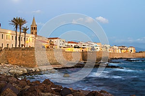 Mediterranean coast of Alghero, Sardinia in the sunset photo