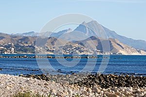 Mediterranean coastal landscape from El Campello and the mountain peak of Puig Campana in the background photo