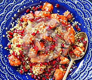 Mediterranean couscous salad with pomegranate seeds photo