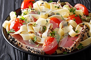 Mediterranean cuisine: fettuccine pasta with tuna in sesame, wit