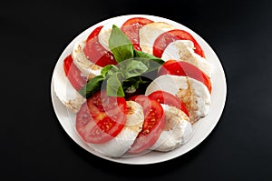 Mediterranean cuisine, fresh vegetarian food and italian culinary art concept with Caprese salad made of mozzarella cheese,